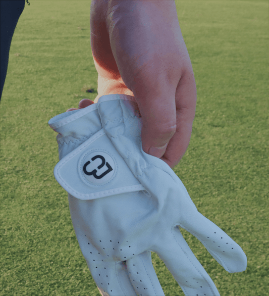 Golfer holding a B&C Golf glove